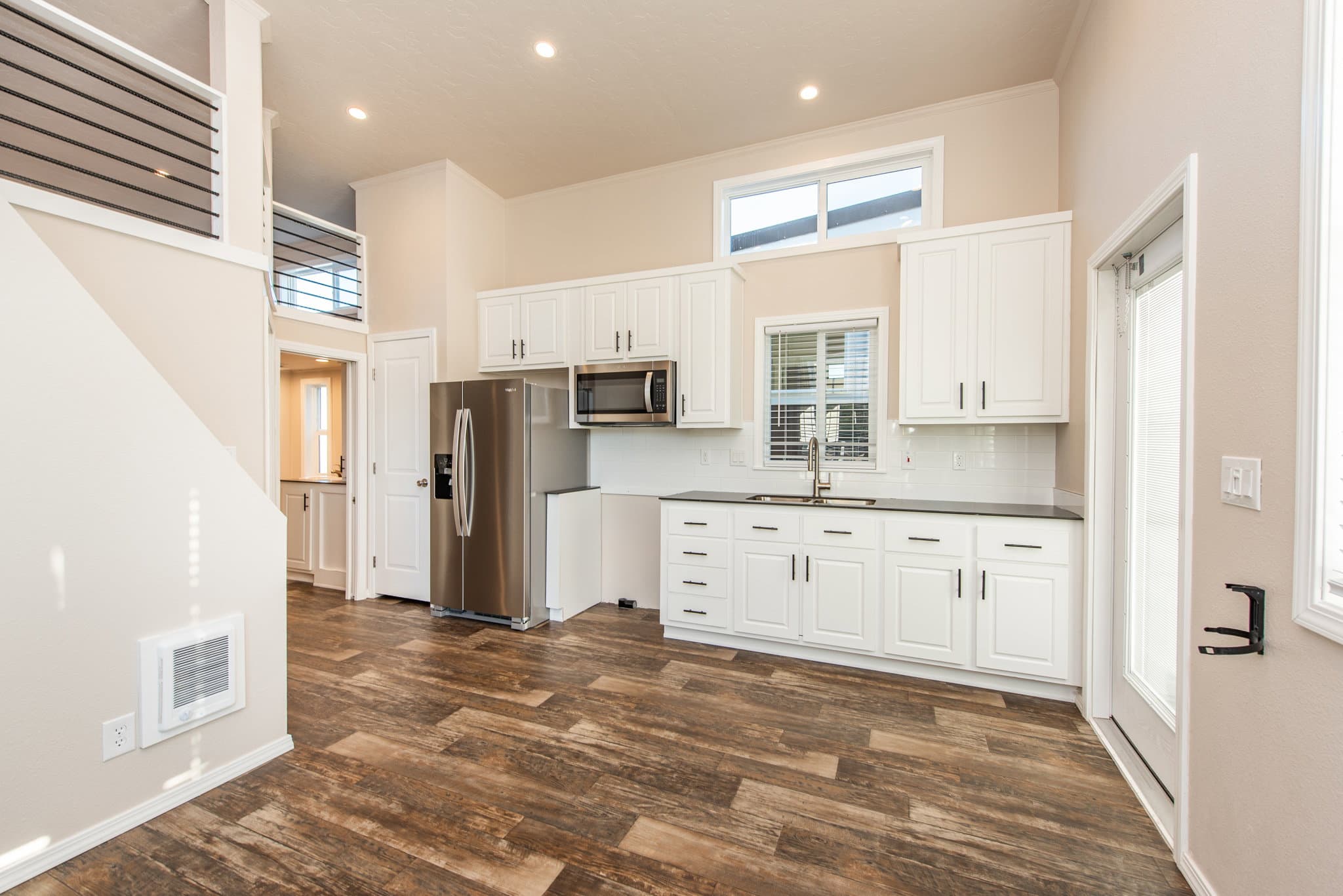The lofted olympic kitchen home features